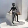 Urban Thinker? Glossy Black Resin Seated Figure Sculpture